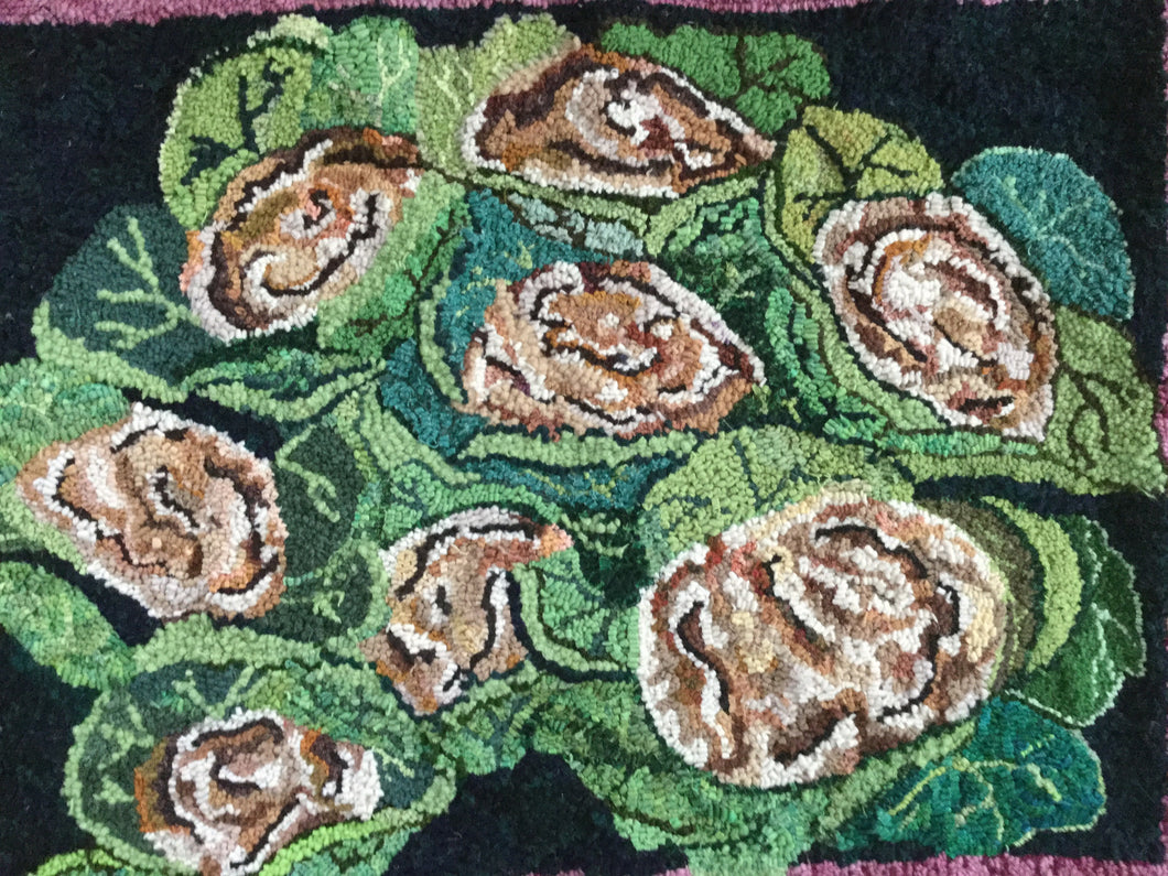 hand hooked rug of cauliflowers in natural, beige and greens